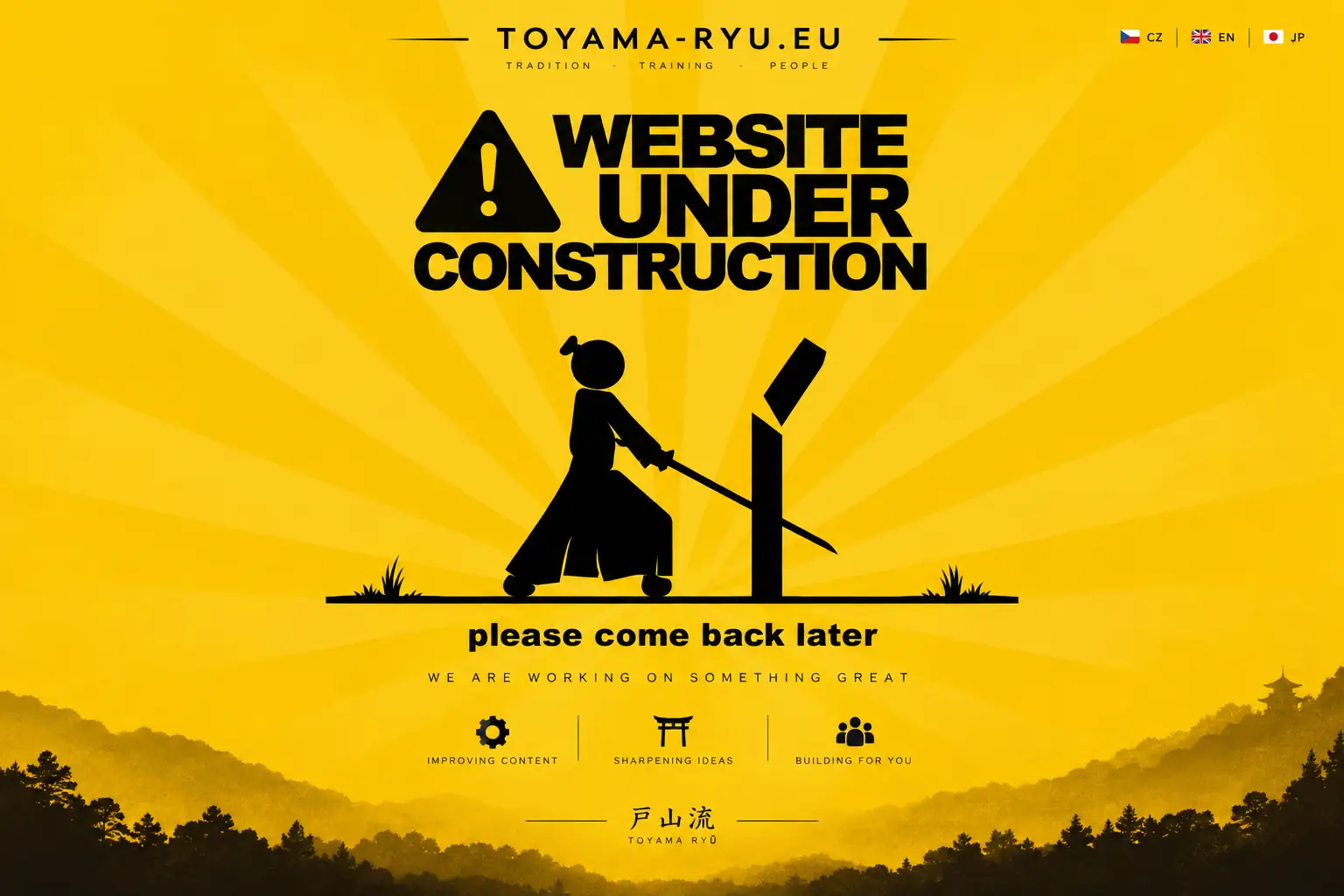 kumakawakai.toyama.cz website under construction — samurai cutting a training target against a yellow Japanese-inspired landscape